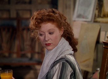 Movie still from “The Red Shoes” (1948), directed by Michael Powell – A person wearing a scarf; Close Up shot, Over the shoulder angle