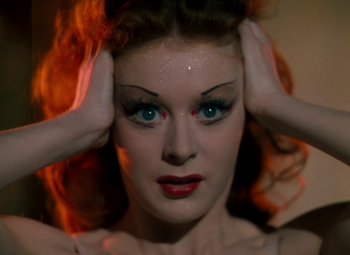 Movie still from “The Red Shoes” (1948), directed by Michael Powell – A person with makeup on; Close Up shot, High angle