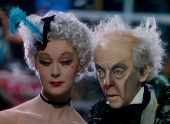 Movie still from “The Red Shoes” (1948), directed by Michael Powell – A man and a woman dressed up like a couple; Close Up shot, Low angle