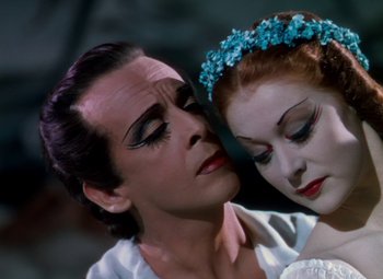 Movie still from “The Red Shoes” (1948), directed by Michael Powell – A man and a woman are looking at one another; Close Up shot, Low angle