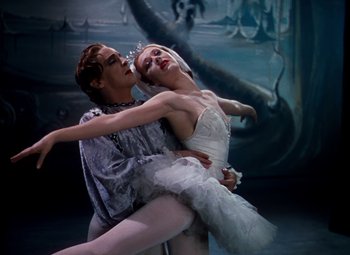 Movie still from “The Red Shoes” (1948), directed by Michael Powell – A couple of people that are in a dance pose; Medium shot, Low angle
