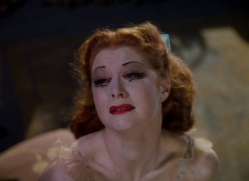 Movie still from “The Red Shoes” (1948), directed by Michael Powell – A person wearing a costume; Close Up shot, High angle