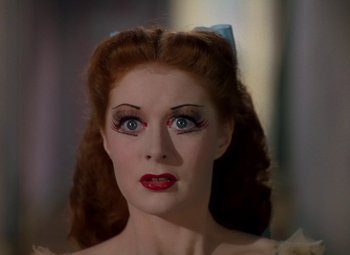 Movie still from “The Red Shoes” (1948), directed by Michael Powell – A person with makeup on; Close Up shot, High angle
