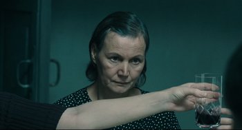 A woman is holding her arm up in the air