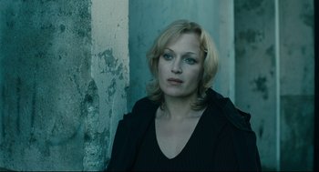 Movie still from “The Return” (2003), directed by Andrey Zvyagintsev – A woman in a black jacket is looking into the distance; Close Up shot, High angle