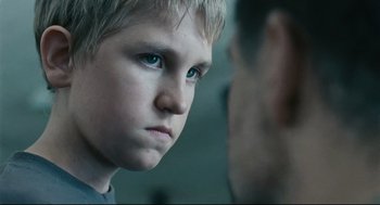 Movie still from “The Return” (2003), directed by Andrey Zvyagintsev – A young boy staring at another person in a mirror; Close Up shot, Over the shoulder angle