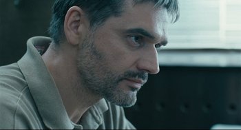 Movie still from “The Return” (2003), directed by Andrey Zvyagintsev – A person with a beard; Close Up shot, Over the shoulder angle