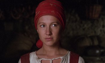 Movie still from “The Return of Martin Guerre” (1982), directed by Daniel Vigne – A woman wearing a red head wrap and a white shirt; Close Up shot, Low angle