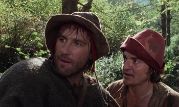Movie still from “The Return of Martin Guerre” (1982), directed by Daniel Vigne – Two men wearing hats are standing next to each other; Close Up shot, Over the shoulder angle