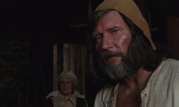 Movie still from “The Return of Martin Guerre” (1982), directed by Daniel Vigne – A man with a long beard standing next to a woman; Close Up shot, Over the shoulder angle