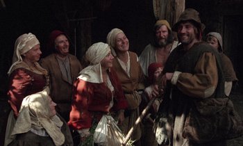 Movie still from “The Return of Martin Guerre” (1982), directed by Daniel Vigne – A group of people dressed in medieval clothing; Wide shot, Low angle