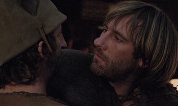 Movie still from “The Return of Martin Guerre” (1982), directed by Daniel Vigne – A man with a beard is holding another man's face; Close Up shot, Over the shoulder angle
