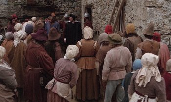 Movie still from “The Return of Martin Guerre” (1982), directed by Daniel Vigne – A group of people dressed in medieval clothing; Wide shot, High angle