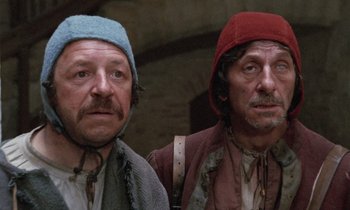 Movie still from “The Return of Martin Guerre” (1982), directed by Daniel Vigne – A couple of men standing next to each other; Close Up shot, Low angle