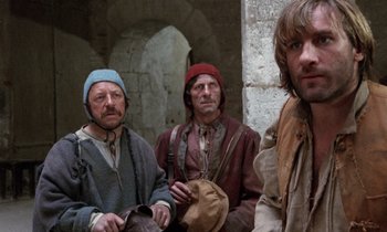 Movie still from “The Return of Martin Guerre” (1982), directed by Daniel Vigne – A group of men standing next to each other; Medium shot, Over the shoulder angle