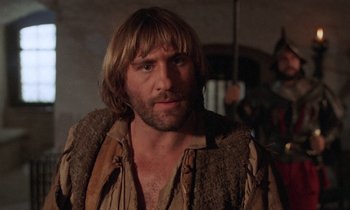 Movie still from “The Return of Martin Guerre” (1982), directed by Daniel Vigne – A person with long brown hair; Close Up shot, Low angle