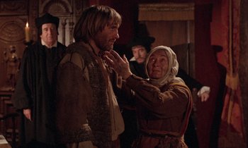 Movie still from “The Return of Martin Guerre” (1982), directed by Daniel Vigne – An older woman is touching a younger man's face; Medium shot, Over the shoulder angle