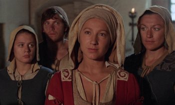 Movie still from “The Return of Martin Guerre” (1982), directed by Daniel Vigne – A group of people standing next to each other; Close Up shot, Low angle