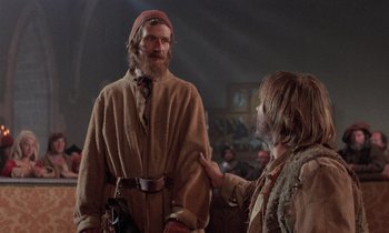 Movie still from “The Return of Martin Guerre” (1982), directed by Daniel Vigne – A man with a long beard and a man with a long beard; Medium shot, Low angle