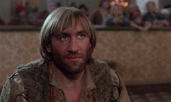 Movie still from “The Return of Martin Guerre” (1982), directed by Daniel Vigne – A person with long hair and a beard; Close Up shot, Low angle