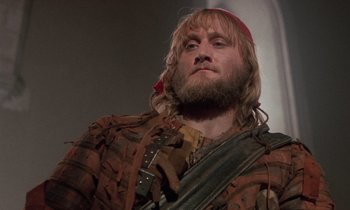 Movie still from “The Return of Martin Guerre” (1982), directed by Daniel Vigne – A man with long hair and a red bandanna; Close Up shot, Low angle