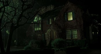 Movie still from “The Ring” (2002), directed by Gore Verbinski – A house that is lit up at night time; Extreme Wide shot, Low angle