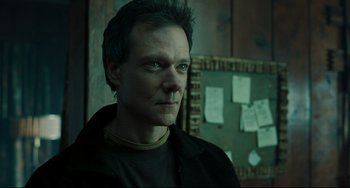 Movie still from “The Ring” (2002), directed by Gore Verbinski – A person wearing a black jacket; Close Up shot, Low angle