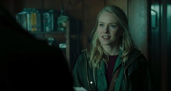 Movie still from “The Ring” (2002), directed by Gore Verbinski – A woman in a green jacket standing in front of a wall; Close Up shot, Over the shoulder angle