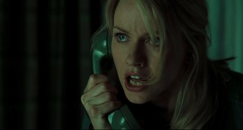 Movie still from “The Ring” (2002), directed by Gore Verbinski – A woman holding a phone up to her ear; Close Up shot, Low angle