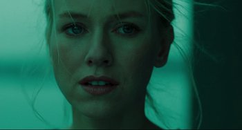 Movie still from “The Ring” (2002), directed by Gore Verbinski – A woman's face in green light; Close Up shot, Over the shoulder angle