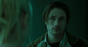 Movie still from “The Ring” (2002), directed by Gore Verbinski – A person looking at a mirror; Close Up shot, Over the shoulder angle