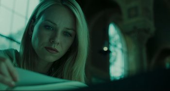 Movie still from “The Ring” (2002), directed by Gore Verbinski – A beautiful blonde woman sitting in front of a window; Close Up shot, Low angle