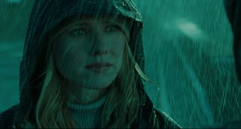 Movie still from “The Ring” (2002), directed by Gore Verbinski – A person wearing a raincoat in the rain; Close Up shot, Low angle