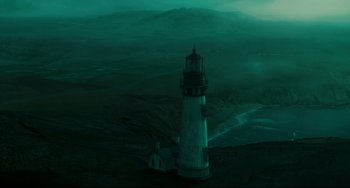 Movie still from “The Ring” (2002), directed by Gore Verbinski – A light house in the middle of a dark night; Extreme Wide shot, High angle