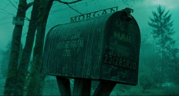 Movie still from “The Ring” (2002), directed by Gore Verbinski – An old rusty mailbox with the name " morgan " on it; Wide shot, Low angle