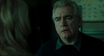Movie still from “The Ring” (2002), directed by Gore Verbinski – An older man with white hair looking at the camera; Close Up shot, Over the shoulder angle