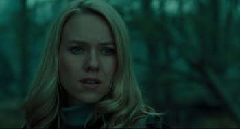 Movie still from “The Ring” (2002), directed by Gore Verbinski – A woman with long blonde hair stares into the camera; Close Up shot, Over the shoulder angle