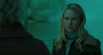 Movie still from “The Ring” (2002), directed by Gore Verbinski – A woman standing in front of a man in a green light; Close Up shot, Over the shoulder angle