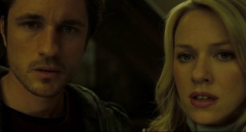 Movie still from “The Ring” (2002), directed by Gore Verbinski – A man and a woman standing next to each other; Close Up shot, Low angle