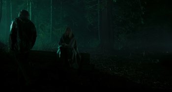 Movie still from “The Ring” (2002), directed by Gore Verbinski – A woman sitting on a bench in the dark; Wide shot, High angle