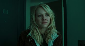 Movie still from “The Ring” (2002), directed by Gore Verbinski – A woman with long blonde hair stares into the camera; Close Up shot, Low angle