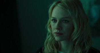 Movie still from “The Ring” (2002), directed by Gore Verbinski – A woman with blonde hair is looking at the camera; Close Up shot, Over the shoulder angle