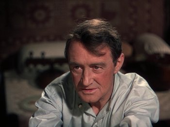 Movie still from “The River” (1951), directed by Jean Renoir – A person sitting in a room; Close Up shot, High angle