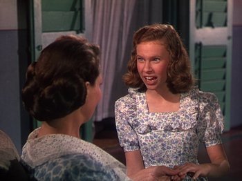 Movie still from “The River” (1951), directed by Jean Renoir – Two women talking to each other in front of a window; Close Up shot, Over the shoulder angle
