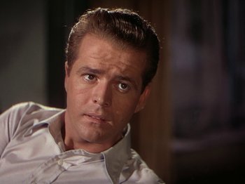 Movie still from “The River” (1951), directed by Jean Renoir – A person wearing a white shirt; Close Up shot, Over the shoulder angle