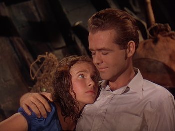 Movie still from “The River” (1951), directed by Jean Renoir – A man and a woman are hugging each other; Close Up shot, Low angle