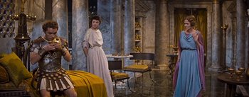 Movie still from “The Robe” (1953), directed by Henry Koster – A woman standing in front of a chess board; Wide shot, High angle