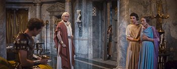 Movie still from “The Robe” (1953), directed by Henry Koster – A man dressed as a roman emperor stands in front of a doorway; Wide shot, Over the shoulder angle