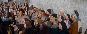 Movie still from “The Robe” (1953), directed by Henry Koster – A group of people standing next to each other; Wide shot, High angle