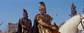 Movie still from “The Robe” (1953), directed by Henry Koster – A man in a roman soldier outfit with a sword; Medium shot, Low angle